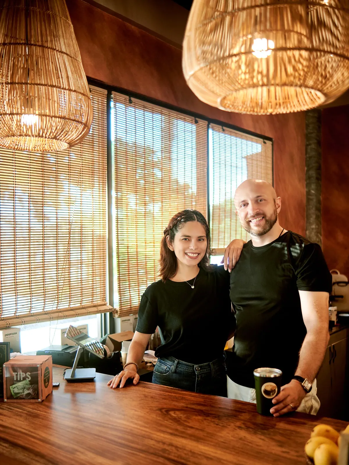 Sasha and Natasha behind the SANA bar — the owners