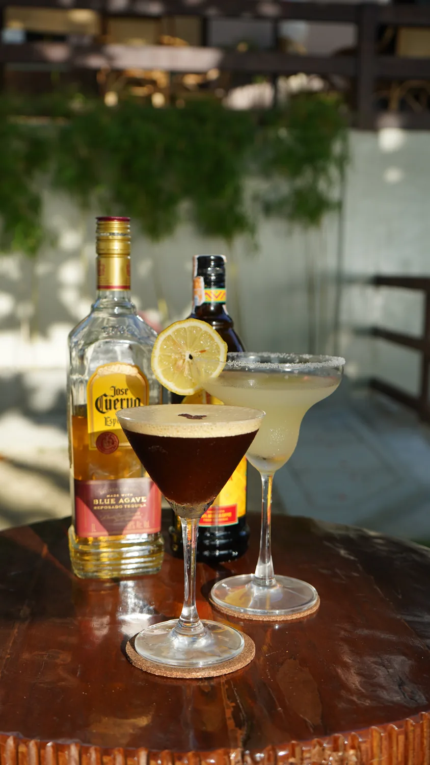 Two signature cocktails in golden afternoon light at SANA Cafe