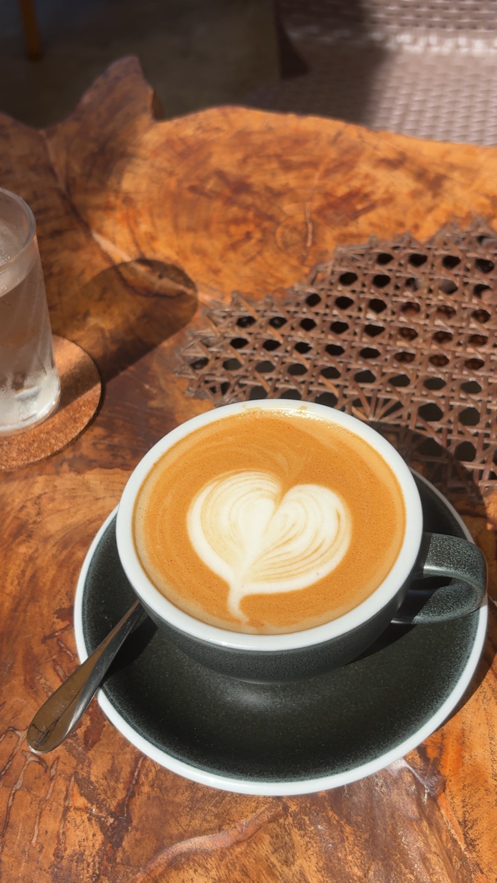 Heart latte art crafted at Sana Cafe with sea view